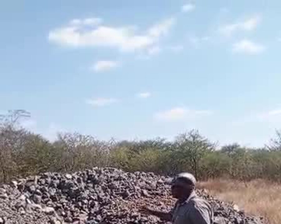 ProAfrica team inspecting a chrome ore stockpile in the field